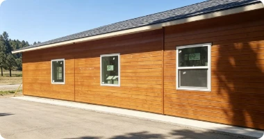 Four examples of completed modern metal siding looks